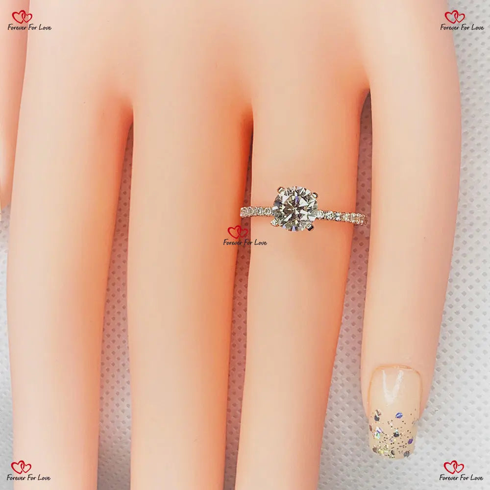 Side view of round hidden halo engagement ring with 6.5mm center stone design