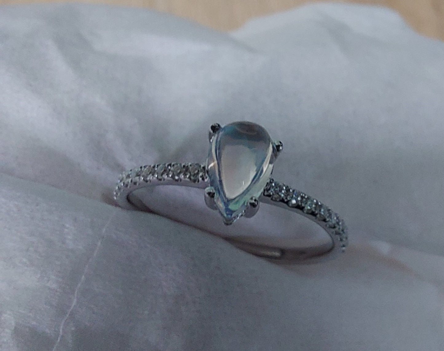 Bague de fiançailles poire moissanite et pierre de lune Pear cut Moissanite taille brillant engagement ring in Gold or Platinum — custom handcrafted by Forever For Love