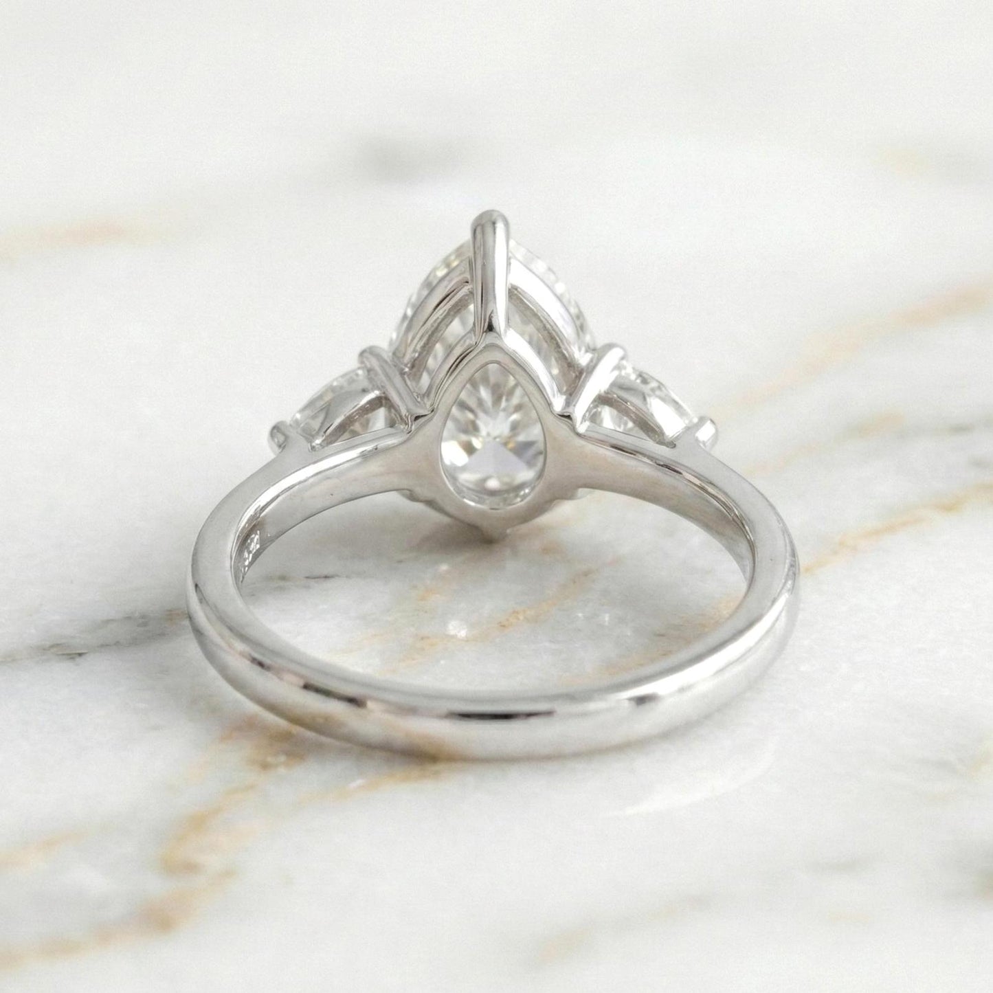 Bague de Fiançailles Trilogie Poire 2,5 Carats en Diamant de Laboratoire Certifié IGI Pear cut Moissanite engagement ring in Gold or Platinum — custom handcrafted by Forever For Love