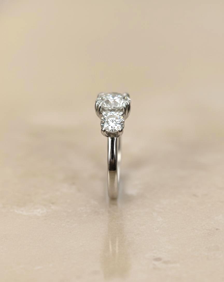 Bague de Fiançailles Trilogy en Diamant de Laboratoire Certifié IGI de 3 Carats Round cut Moissanite engagement ring in Gold or Platinum — custom handcrafted by Forever For Love