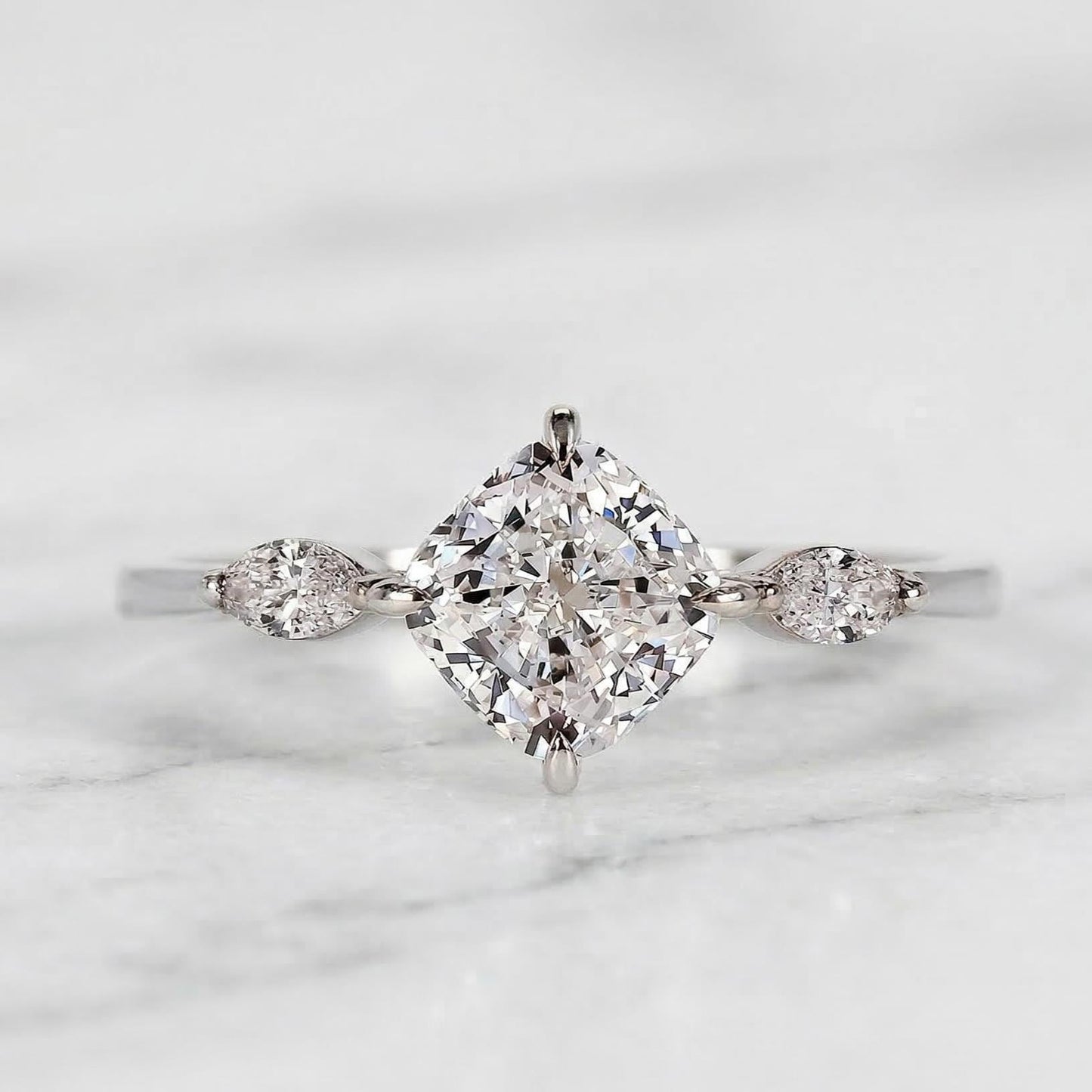 Ring mit kissenförmigem Labordiamant und drei Steinen Cushion cut Moissanite engagement ring in Gold or Platinum — custom handcrafted by Forever For Love