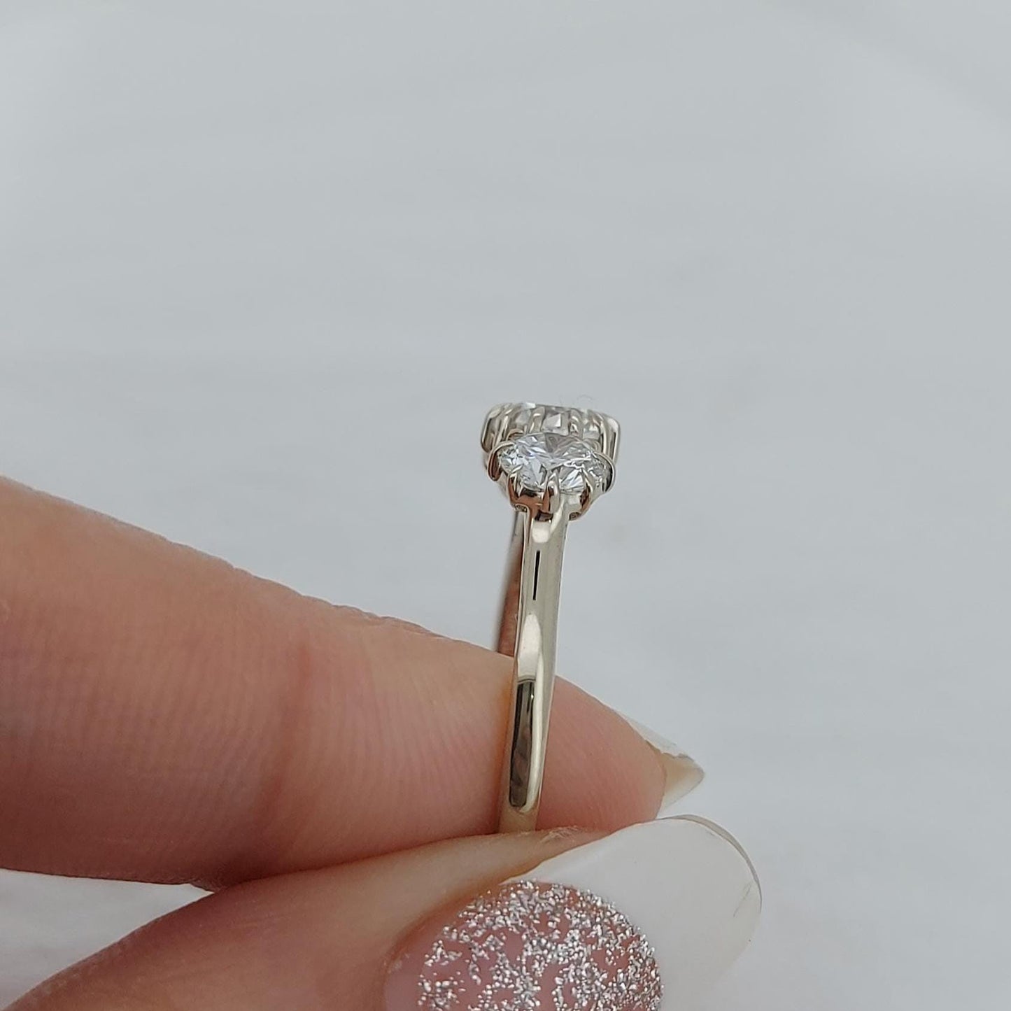 Bague de fiançailles trilogie avec diamant rond naturel Round cut Moissanite engagement ring in Gold or Platinum — custom handcrafted by Forever For Love