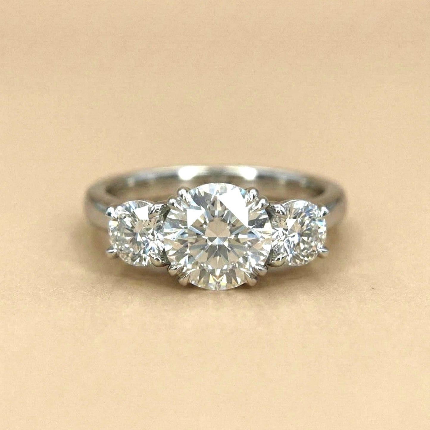 Bague de Fiançailles Trilogy en Diamant de Laboratoire Certifié IGI de 3 Carats Round cut Moissanite engagement ring in Gold or Platinum — custom handcrafted by Forever For Love