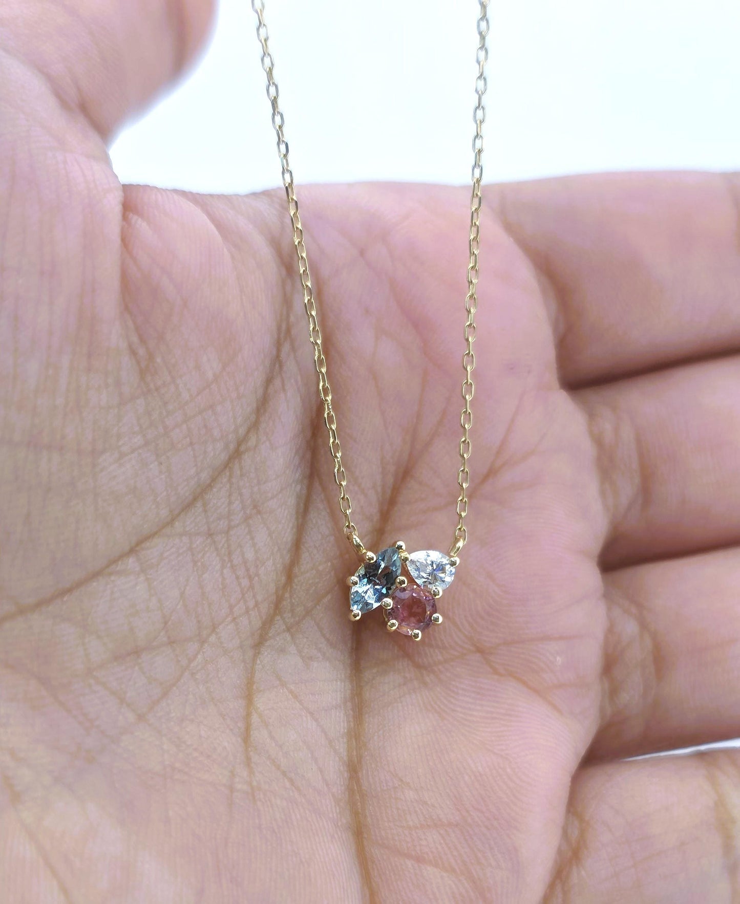 Mehrstein-Halskette handgefertigt mit blauem Topas, Turmalin und Diamant in massivem Gold und Silber. Besonderes Geschenk für sie. Moissanite engagement ring in Gold or Platinum — custom handcrafted by Forever For Love