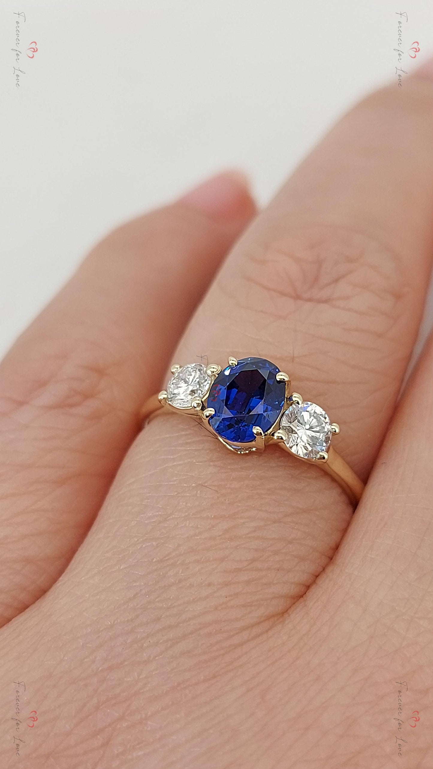 Bague à trois pierres saphir et diamant de laboratoire bleu rond Round cut Moissanite engagement ring in Gold or Platinum — custom handcrafted by Forever For Love