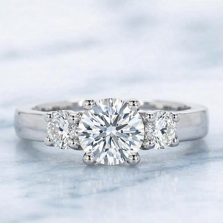 Round Lab Diamond Three Stone Trilogy Engagement Ring Round cut Moissanite engagement ring in Gold or Platinum — custom handcrafted by Forever For Love