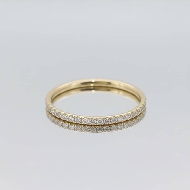 Bague demi-éternité en diamants ronds de laboratoire Round cut Moissanite taille brillant engagement ring in Gold or Platinum — custom handcrafted by Forever For Love