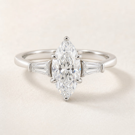 Moval Three Stone Engagement Ring With Tapered Baguette Accents