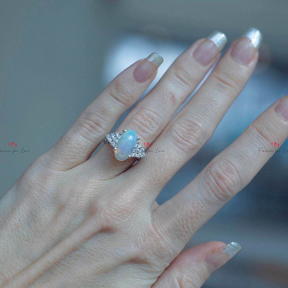 Oval Cut Opal Engagement Ring with Diamond Cluster