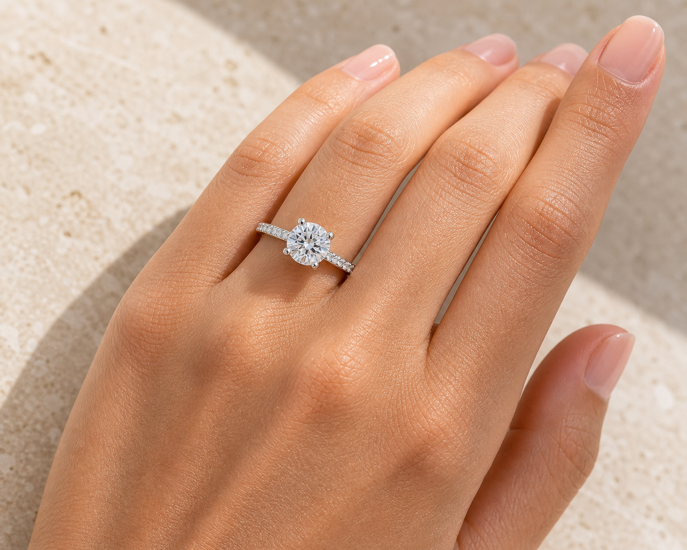 Model wearing 1.26 ct round hidden halo engagement ring - Sample Silver / Cubic Zirconia / 1