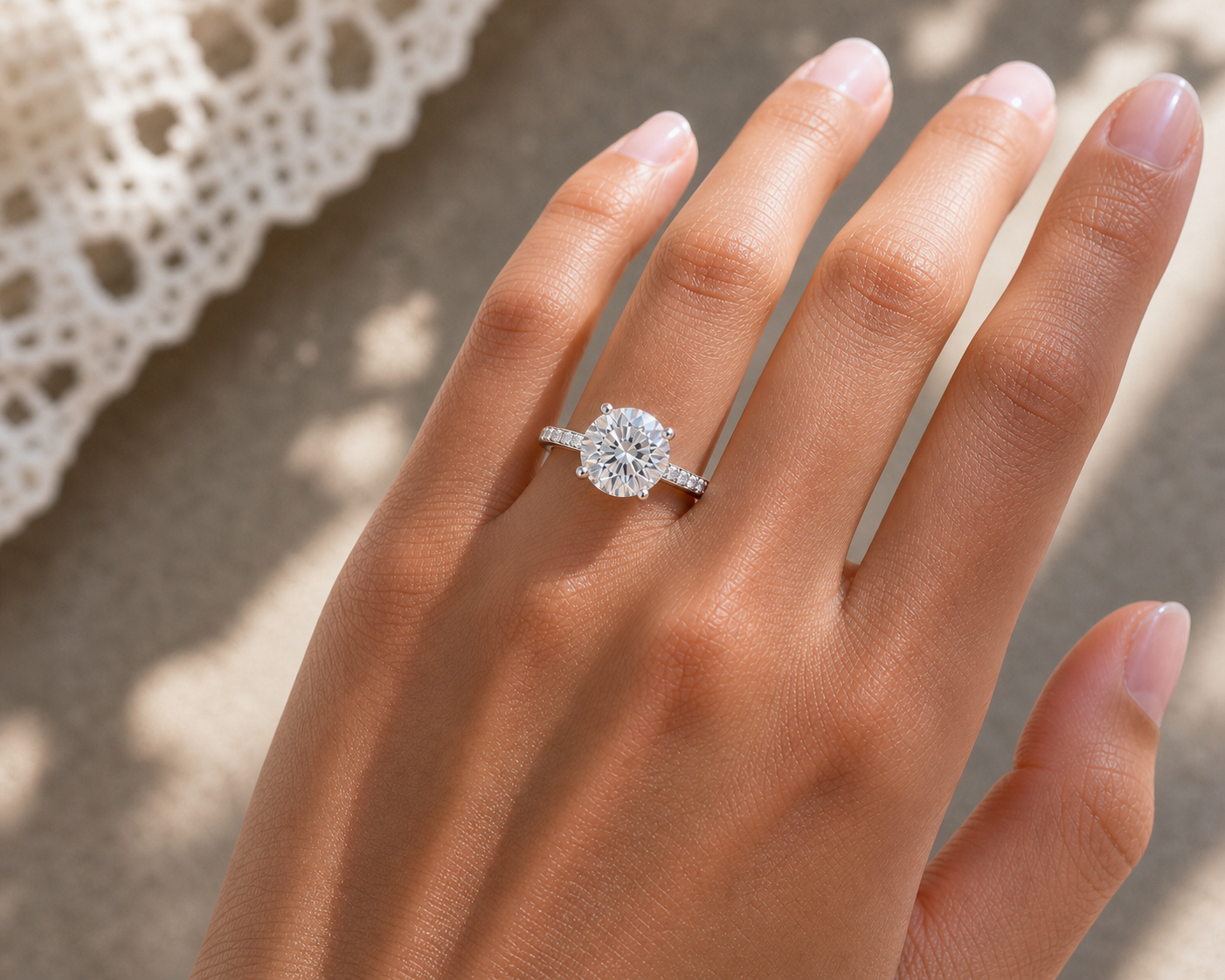 Round brilliant hidden halo engagement ring in silver